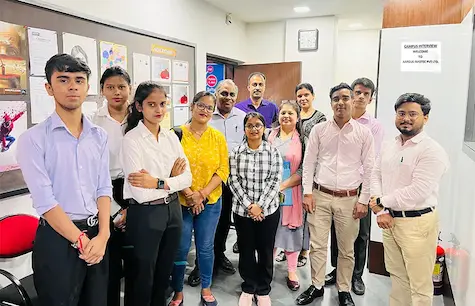 Formal group photo of faculty and students after an interview session