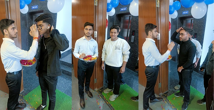 Students welcoming guests with a tilak and rose petals