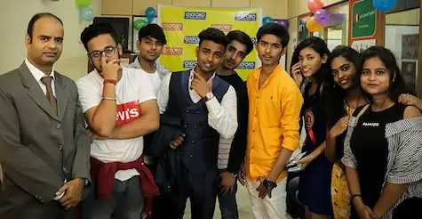 Students posing confidently during institute event