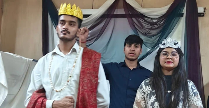 Students performing a dramatic scene from the Macbeth play